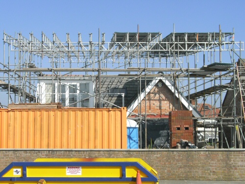 Access scaffolding and temporary roof erected to bungalow on the the sea-front at Thornton Cleveleys, Lancashire